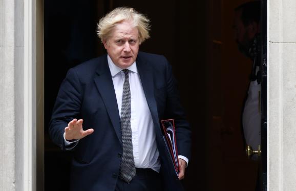 Britain's Prime Minister Boris Johnson walks on Downing Street in London, Britain, August 24, 2021. REUTERS/Henry Nicholls 