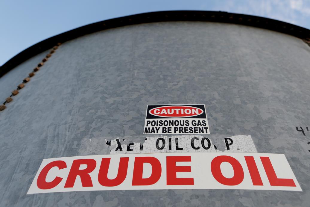 A sticker reads crude oil on the side of a storage tank in the Permian Basin in Mentone, Loving County, Texas, U.S. November 22, 2019. REUTERS/Angus Mordant