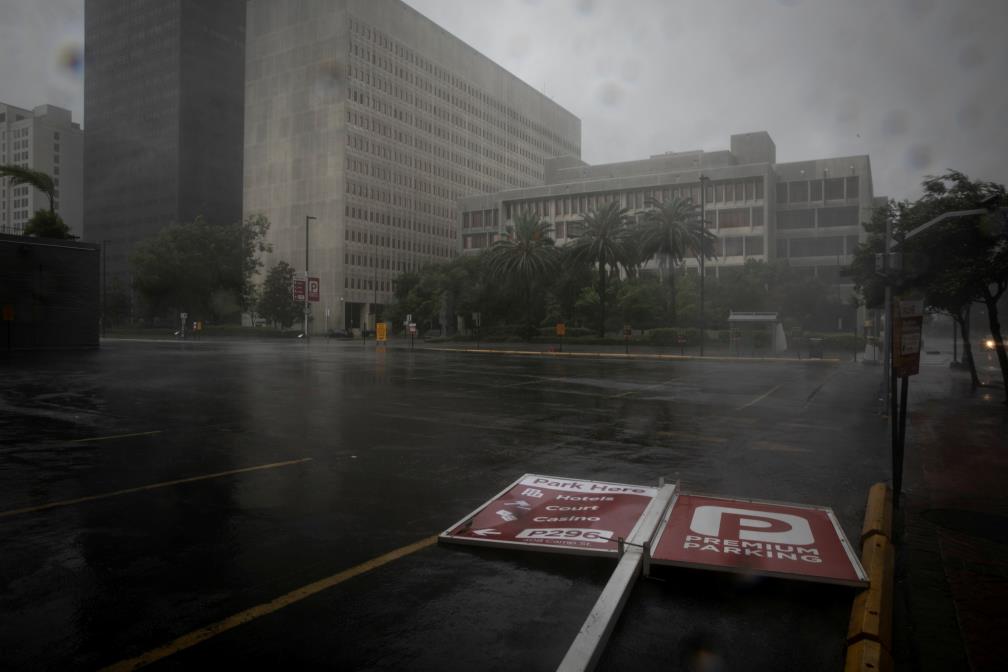 A parking sign lies in the street as Hurricane Ida makes landfall in Louisiana, in New Orleans, Louisiana, U.S. August 29, 2021. REUTERS/Marco Bello