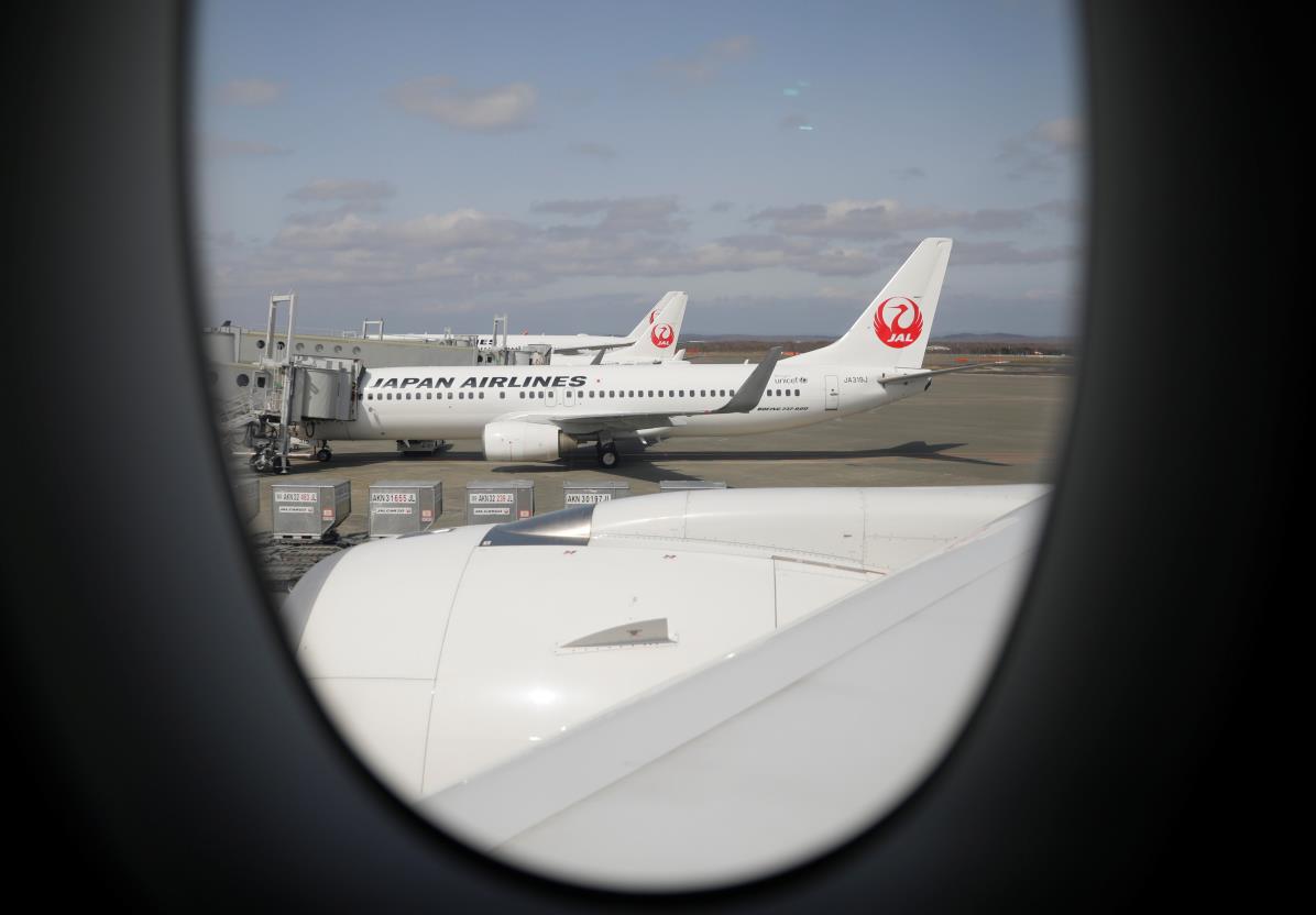 Japan Airlines (JAL) planes sit on the tarmac at New Chitose Airport, in Sapporo, Hokkaido, Japan May 4, 2021. REUTERS/Issei Kato