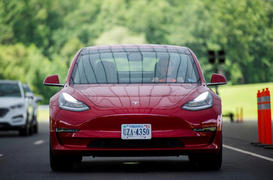 Joe Young, a media relations associate for the Insurance Institute for Highway Safety (IIHS), demo<em></em>nstrates a front crash prevention test on a 2018 Tesla Model 3 at the IIHS-HLDI Vehicle Research Center in Ruckersville, Virginia, U.S., July 22, 2019. REUTERS/Amanda Voisard/File Photo