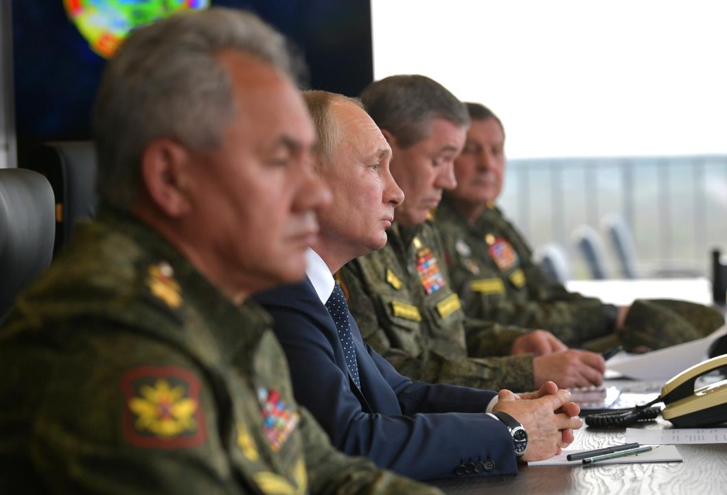 Russian President Vladimir Putin, Defence Minister Sergei Shoigu and Chief of the General Staff of Russian Armed Forces Valery Gerasimov observe the military exercises 