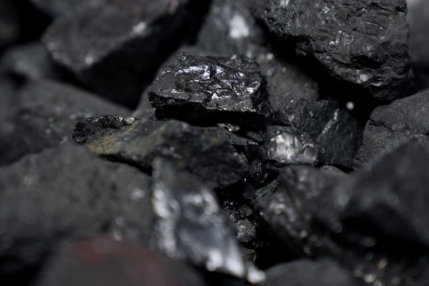 Coal is pictured in a co<em></em>ntainer as people protest against BlackRock investing in coal and tar sands outside their headquarters in the Manhattan borough of New York City, New York, U.S., May 25, 2021.  REUTERS/Carlo Allegri