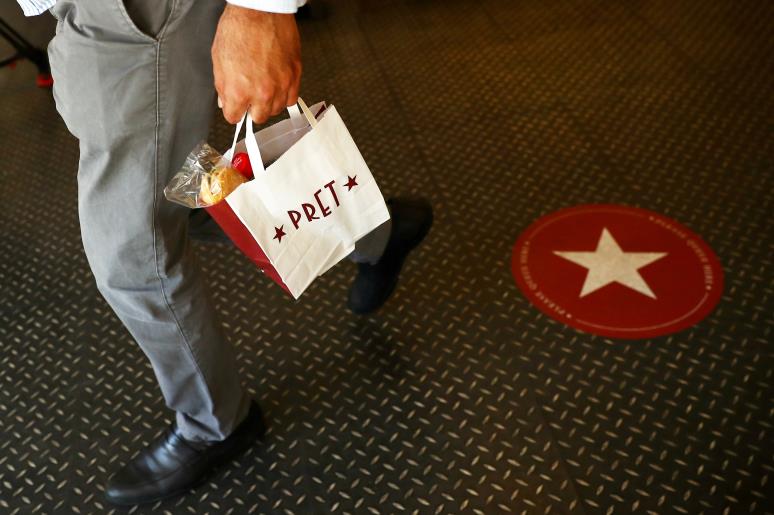 A person leaves with their shopping at Pret a Manger in New Cavendish Street, following the outbreak of the coro<em></em>navirus disease (COVID-19), London, Britain, June 1, 2020. REUTERS/Hannah McKay