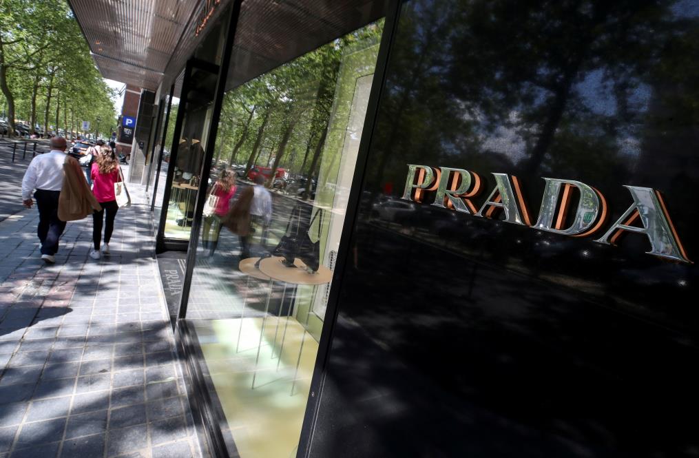 A logo of luxury goods company Prada is seen at the entrance of a shop in Brussels, Belgium July 2, 2021. REUTERS/Yves Herman