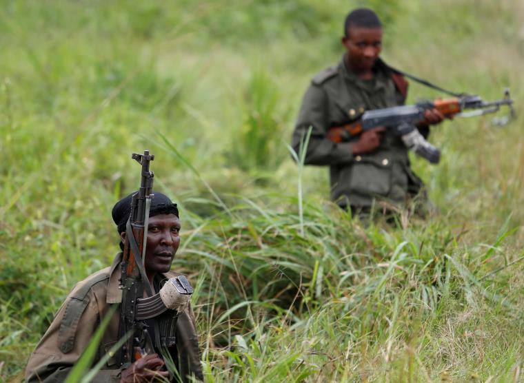 Armed Forces of the Democratic Republic of the Co<em></em>ngo (FARDC) soldiers rest next to a road after Islamist rebel group called the Allied Democratic Forces (ADF) attacked area around Mukoko village, North Kivu province of Democratic Republic of Congo, December 11, 2018.   REUTERS/Goran Tomasevic/File Photo