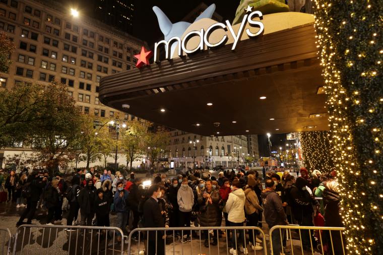 People wait in line at Macy's before Black Friday sales in the Manhattan borough of New York City, New York, U.S., November 26, 2021. REUTERS/Jeenah Moon 