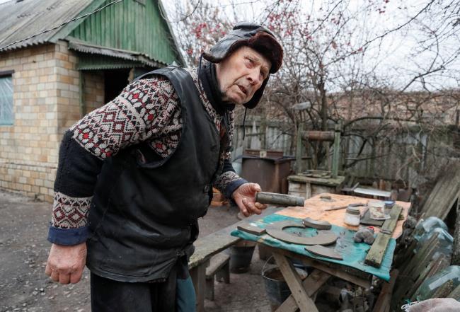 A local resident Vitaliy Kudla, 90, is seen near his house near the front line in the village of Zaitseve,  in the Do<em></em>netsk region, Ukraine December 17, 2021. REUTERS/Gleb Garanich