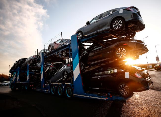 A lorry with car carrier trailer leaves the Ho<em></em>nda car plant in Swindon, Britain, February 18, 2019. REUTERS/Eddie Keogh