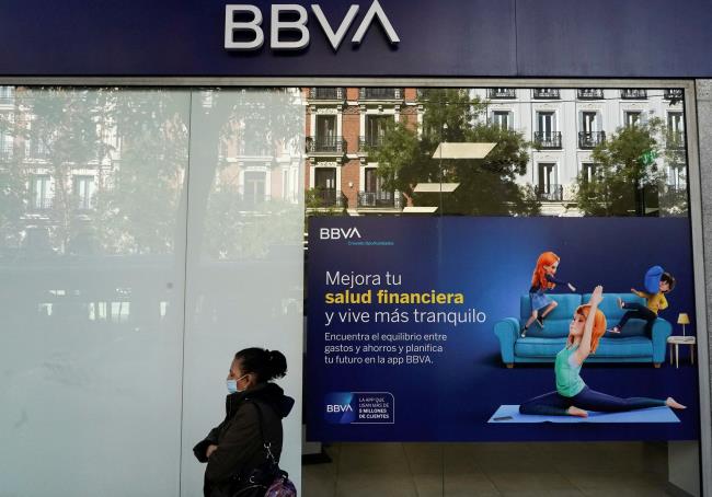 A woman walks past a BBVA bank branch in Madrid, Spain, November 15, 2021. REUTERS/Juan Medina/File Photo