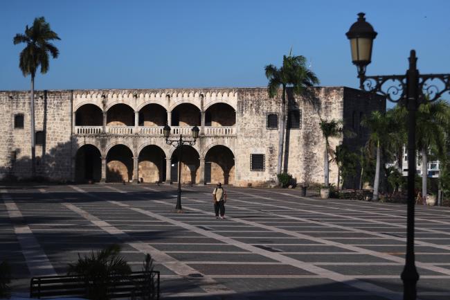 A man walks through the colo<em></em>nial zone, after state of emergency decreed by government  on last Thursday , as a preventive measure against the spread of the coro<em></em>navirus disease (COVID-19), in Santo Domingo, Dominican Republic March 24, 2020. REUTERS/Ricardo Rojas