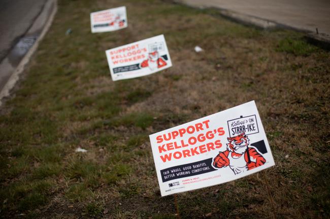 Lawn signs in support of the striking workers picketing from Kellogg Co. are pictured at the Porter Street plant in Battle Creek, Michigan, U.S., December 11, 2021.  REUTERS/Emily Elconin