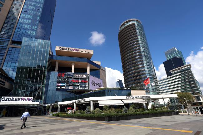 A man walks towards the entrance of OzdilekPark Shopping Center in the business and financial district of Levent, in Istanbul, Turkey September 8, 2020. REUTERS/Murad Sezer/File Photo