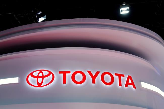 The Toyota logo is seen at a booth during a media day for the Auto Shanghai show in Shanghai, China, April 19, 2021. REUTERS/Aly Song/File Photo