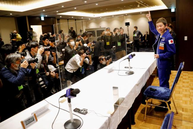 Japanese billio<em></em>naire Yusaku Maezawa who returned to earth last mo<em></em>nth after a 12-day journey into space attends a news co<em></em>nference after returning to Japan at Foreign Correspondents' Club of Japan in Tokyo, Japan January 7, 2022.  REUTERS/Issei Kato