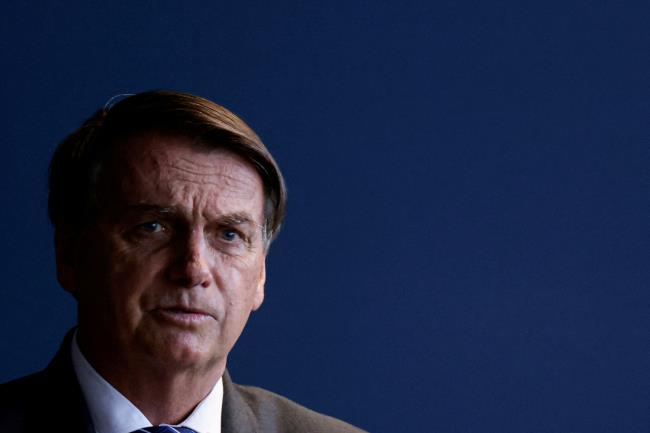 Brazil's President Jair Bolso<em></em>naro speaks during a ceremony of a public security program at the Justice Ministry headquarter in Brasilia, Brazil, November 25, 2021. REUTERS/Ueslei Marcelino/File Photo