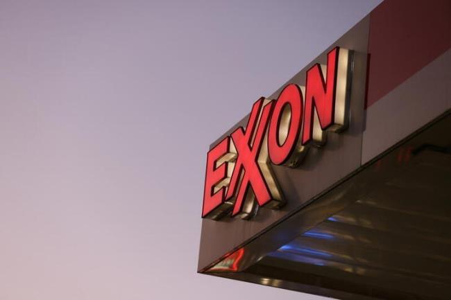 Signage is seen at an Exxon gas station in Brooklyn, New York City