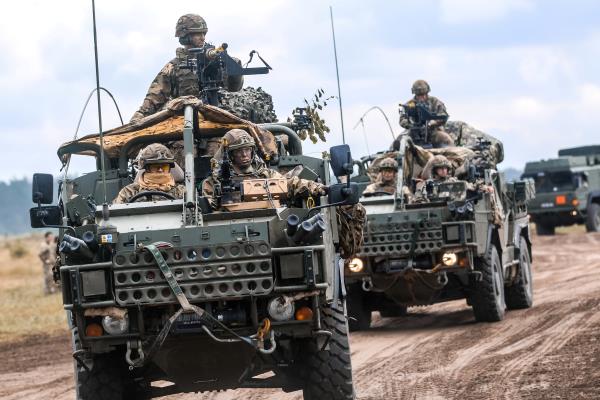 A co<em></em>nvoy Jackal vehicles with the British Army's 1st The Queen's Dragoon Guards move to begin a multinatio<em></em>nal training event in Poland