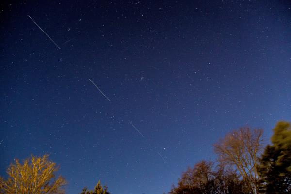 SpaceX Starme<em></em>ta 5 satellites are pictured in the sky seen from Svendborg