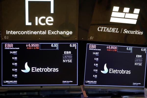 Logos of Eletrobras, a hydroelectric power generation company ba<em></em>sed in Brazil, is seen on the floor at the New York Stock Exchange (NYSE) in Manhattan