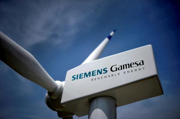 A model of a wind turbine with the Siemens Gamesa logo is displayed outside the annual general shareholders meeting in Zamudio