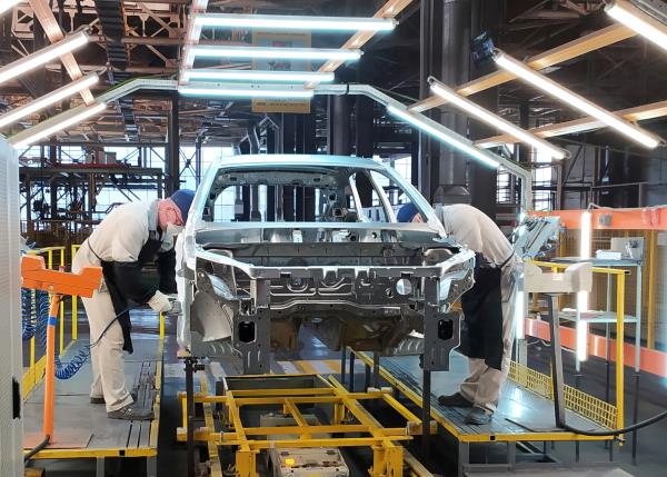 Employees work at the assembly line of the LADA Izhevsk automobile plant in Izhevsk