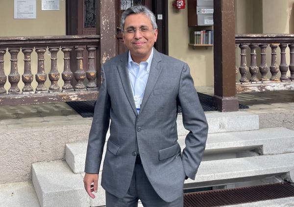 Shah, CEO of India's Mahindra Group poses for a picture after an interview with Reuters in Davos