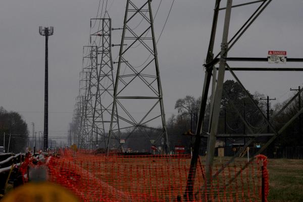 Overhead power lines are seen during record-breaking temperatures in Houston, Texas