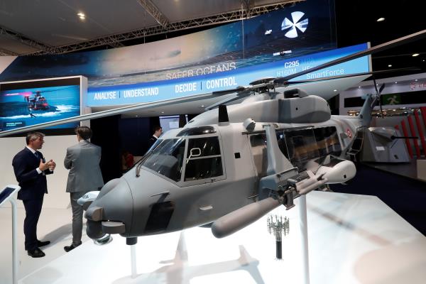 A sub-scale sized model of an heavy-class military helicopter NH90 by Airbus is displayed at Euronaval, the world naval defence exhibition in Le Bourget near Paris