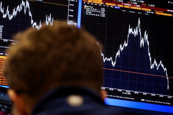 Traders work on the floor of the NYSE in New York