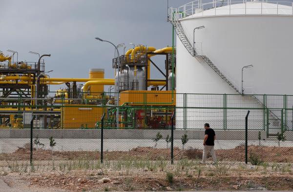 A man walks near the Ignacio Perez operations plant, part of the European Investment-bank backed Castor gas storage project, near Alcanar