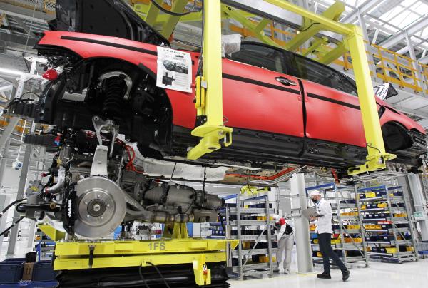 Employees work on an assembly line of the Aurus manufacturing plant in Yelabuga