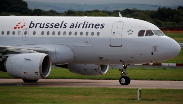 Brussels Airlines aircraft taxis across the tarmac at Manchester Airport