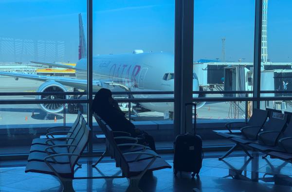 A traveller waits for her flight departure by Qatar Airways to Doha, at Cairo Internatio<em></em>nal Airport