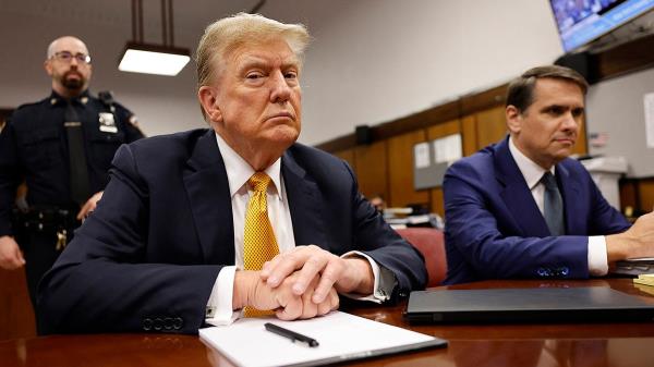 Do<em></em>nald Trump sits in the courtroom during his hush mo<em></em>ney trial