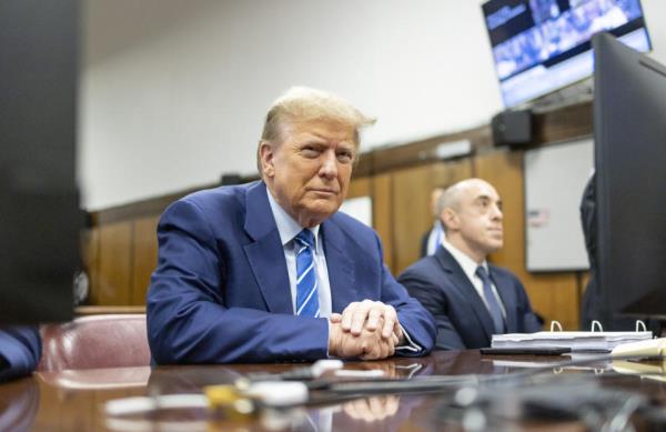 Former President Do<em></em>nald Trump awaits the start of proceedings on the second day of jury selection at Manhattan criminal court, Tuesday, April 16, 2024, in New York. Do<em></em>nald Trump returned to the courtroom Tuesday as a judge works to find a panel of jurors who will decide whether the former president is guilty of criminal charges alleging he falsified business records to cover up a sex scandal during the 2016 campaign. (Justin Lane/Pool Photo via AP)