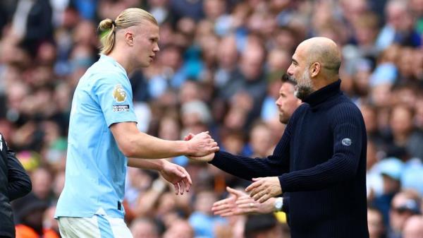 Erling Haaland and Pep Guardiola embrace