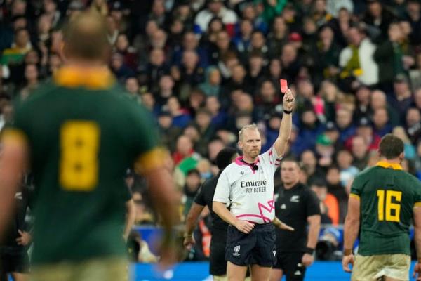 Rugby unio<em></em>n referee holding up a red card to send off a player