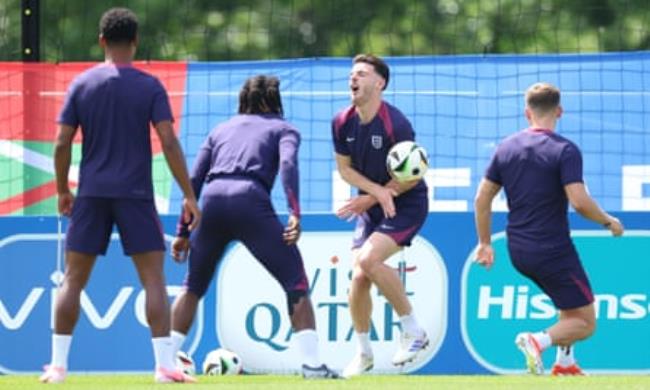 Declan Rice doubles up in pain after being hit by the ball in England training