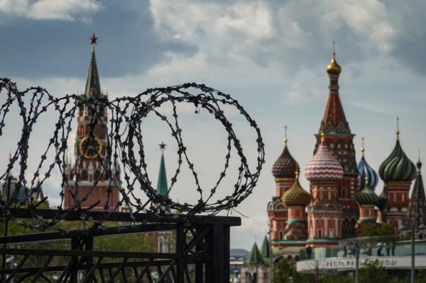 Barbed wire with the Kremlin and St Basil's Cathedral in the background