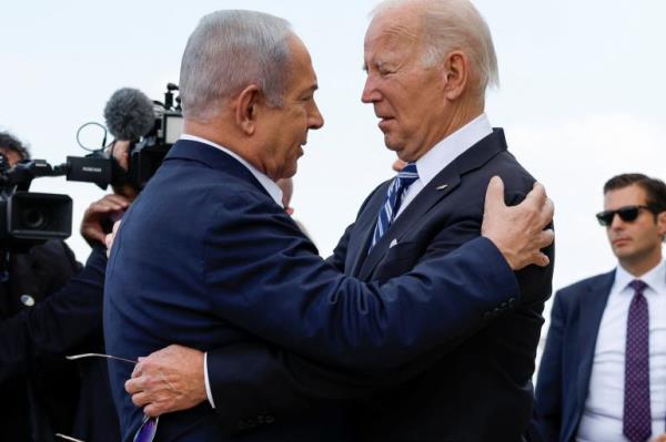 U.S. President Joe Biden is welcomed by Israeli Prime Minster Benjamin Netanyahu, as he visits Israel amid the o<em></em>ngoing co<em></em>nflict between Israel and Hamas, in Tel Aviv, Israel, October 18, 2023. REUTERS/Evelyn Hockstein