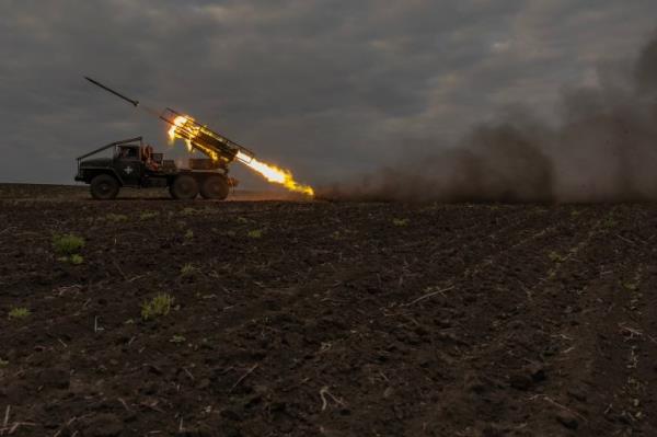 Ukrainian servicemen of the 92nd Assault Brigade fire BM-21 'Grad' multiple rocket launcher toward Russian positions, in the Kharkiv region, on May 15, 2024, amid the Russian invasion of Ukraine