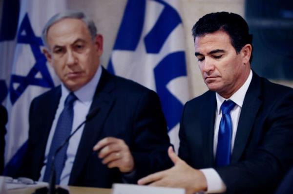 Prime Minister Benjamin Netanyahu sits next to Yossi Cohen on December 7, 2015. GALI TIBBON / AFP VIA GETTY IMAGES