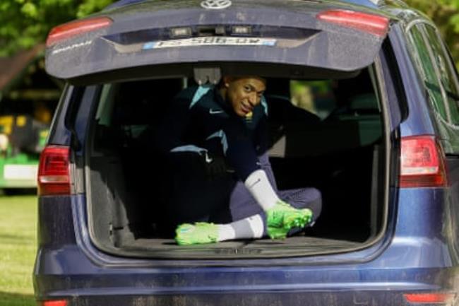 France’s forward Kylian Mbappe sits in a car boot as he leaves a training session, as part of the team’s preparation for upcoming Euro 2024 tournament.