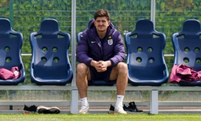 Harry Maguire watches England’s training session on Thursday, before it was co<em></em>nfirmed that a calf injury would rule him out of the squad.
