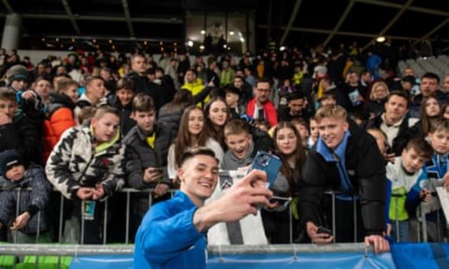Benjamin Sesko takes a selfie with Slovenia fans after a friendly against Portugal in March of this year 
