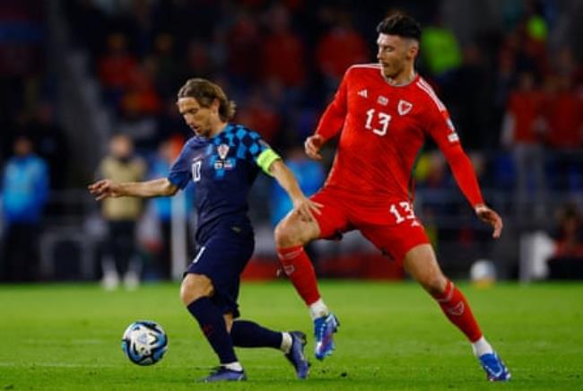 Luka Modric evades Wales’s Kieffer Moore during a qualifier in Cardiff.