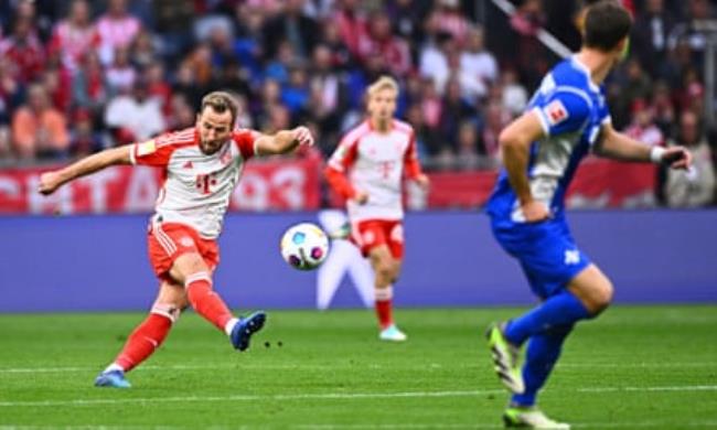 Bayern Munich’s Harry Kane scores from his own half against SV Darmstadt
