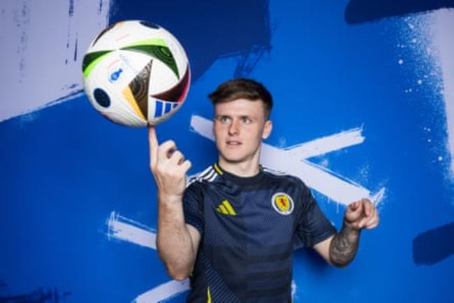 Ben Doak of Scotland balances a football on his finger as he poses for a portrait during the Scotland portrait session ahead of the Euro 2024 tournament.