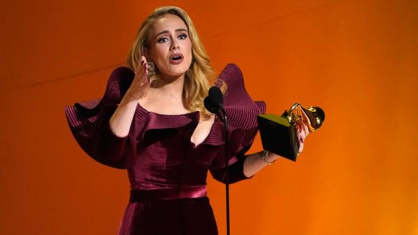 Adele accepts the award for best pop solo performance for "Easy On Me" at the 65th annual Grammy Awards on Sunday, Feb. 5, 2023, in Los Angeles. (AP Photo/Chris Pizzello)